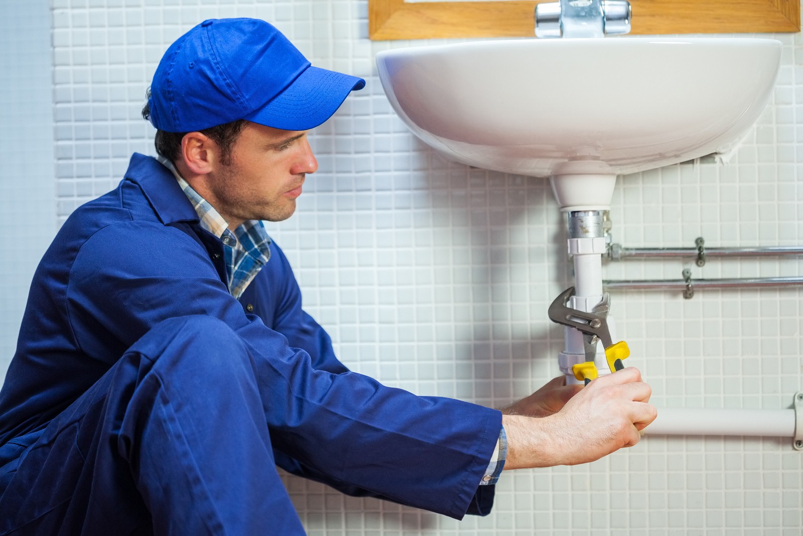 Plumber-Fixing-the-Sink.jpg