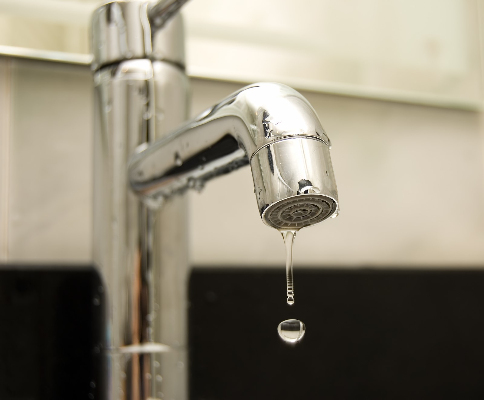 bathroom faucet dripping under sink